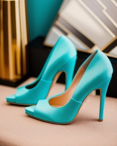 turquoise high heels with gold buckle